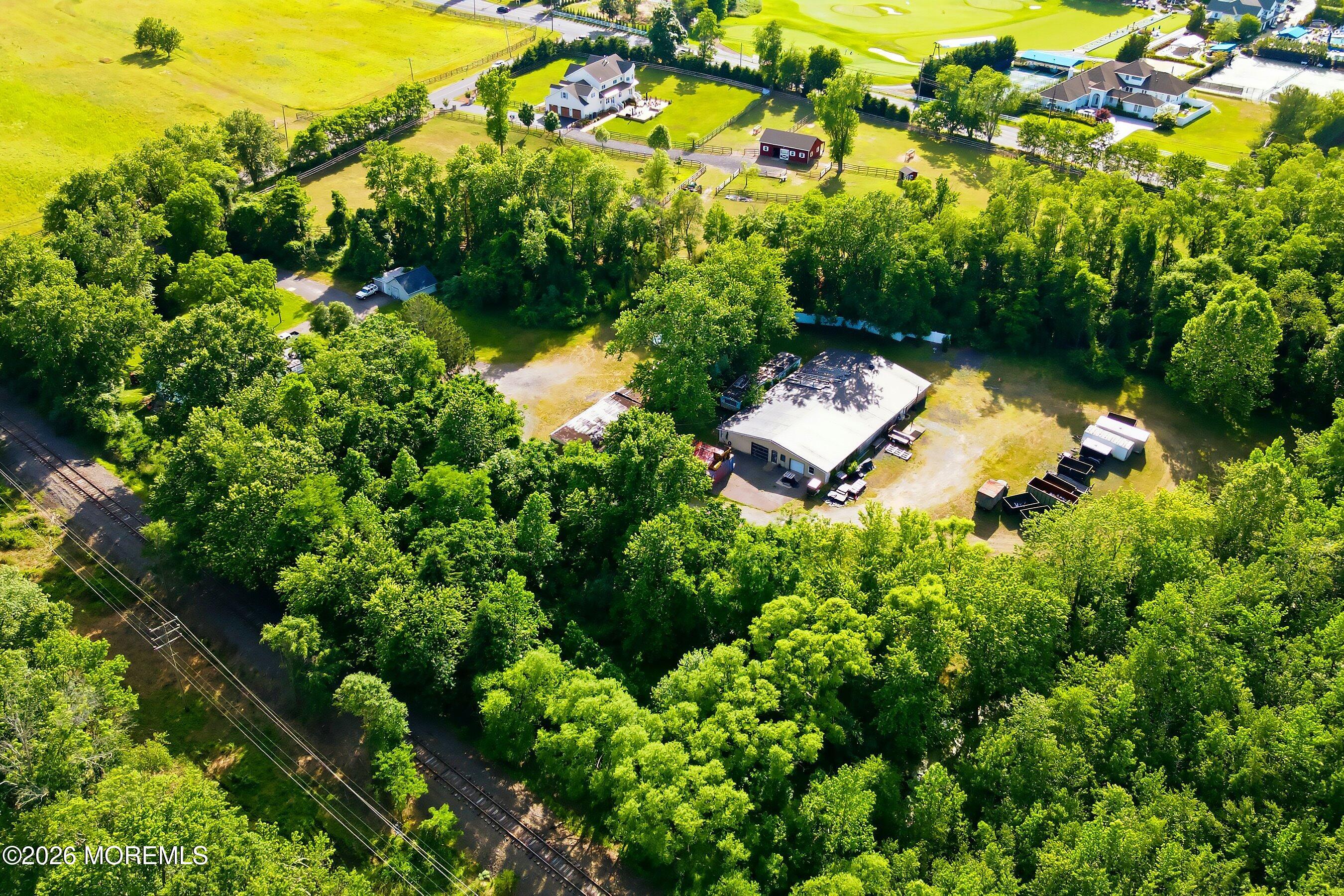 26 Megill Road Farmingdale, NJ 07727 - Photo 15 of 16 an aerial view of a house with a yard
