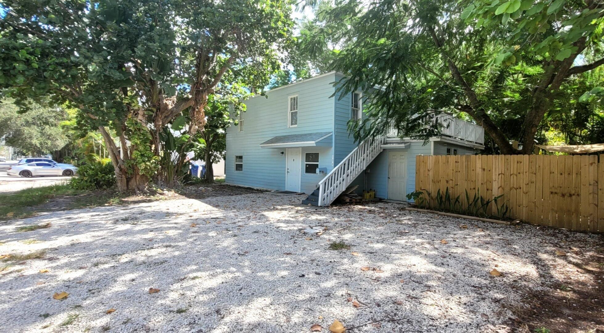 104 Northeast 5th Street Fort Lauderdale, FL 33301 - Photo 1 of 26 a view of backyard with a barn and large tree