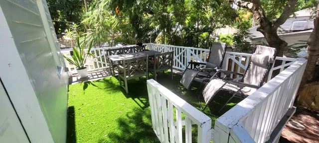 a bathroom with a toilet a sink and a mirror