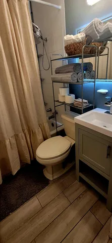 a bedroom with two beds and windows