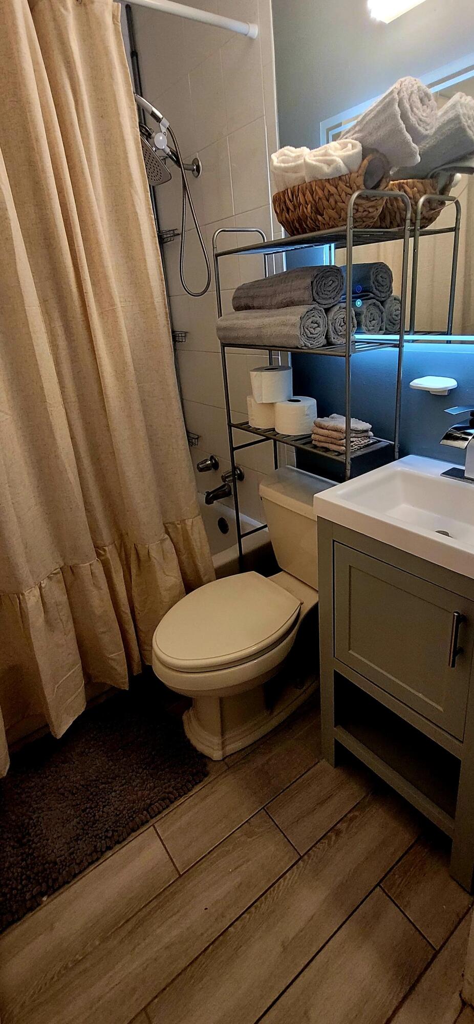 104 Northeast 5th Street Fort Lauderdale, FL 33301 - Photo 15 of 26 a bathroom with a toilet a sink and a mirror