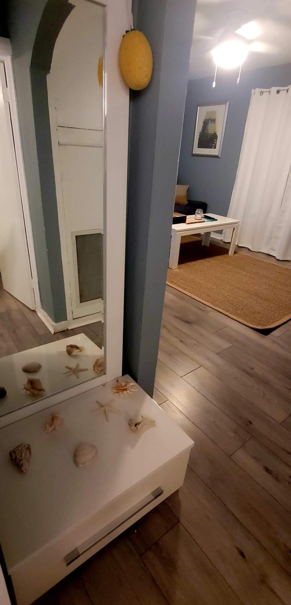 104 Northeast 5th Street Fort Lauderdale, FL 33301 - Photo 19 of 26 a bedroom with a bed and a mirror