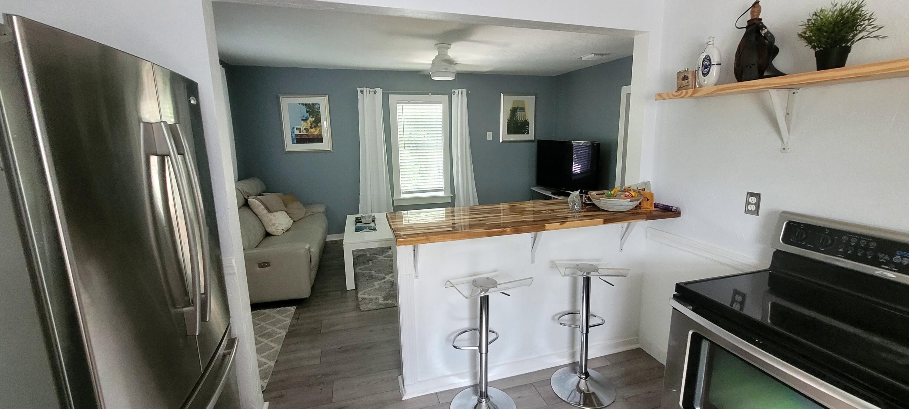104 Northeast 5th Street Fort Lauderdale, FL 33301 - Photo 20 of 26 a kitchen with stainless steel appliances granite countertop a refrigerator and a stove top oven