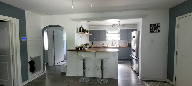 a room with furniture a washer and dryer