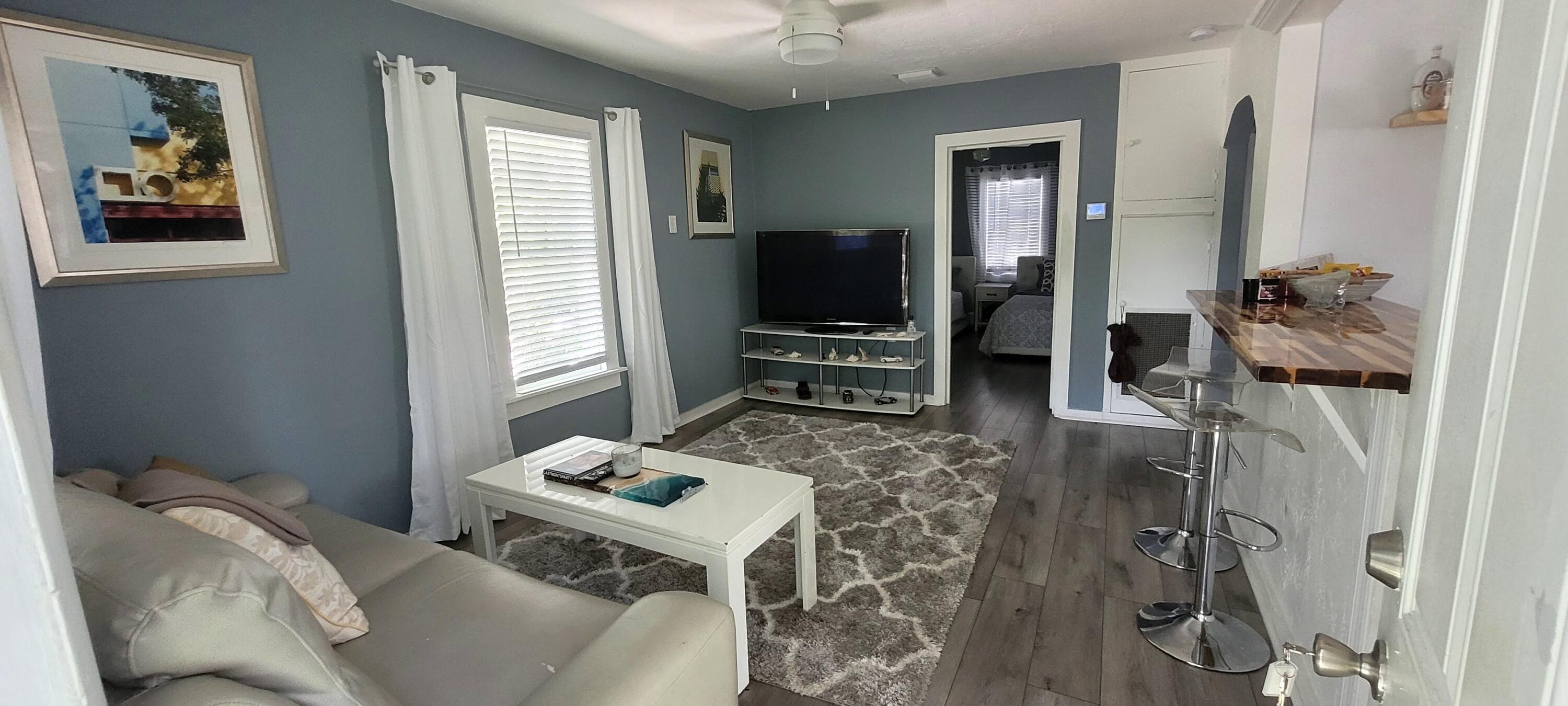 104 Northeast 5th Street Fort Lauderdale, FL 33301 - Photo 24 of 26 a living room with furniture and a flat screen tv