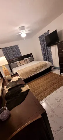 a view of bedroom with furniture