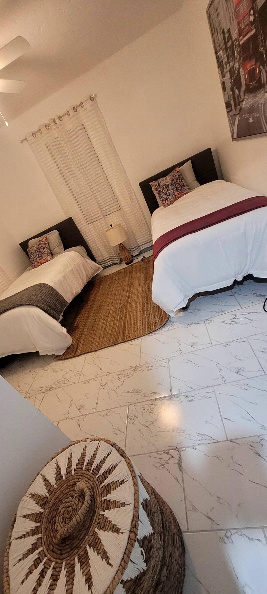 104 Northeast 5th Street Fort Lauderdale, FL 33301 - Photo 6 of 26 a bedroom with a bed and a couch