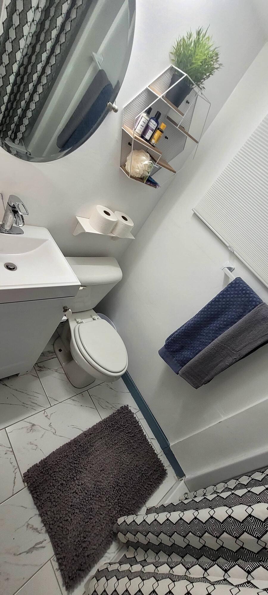 104 Northeast 5th Street Fort Lauderdale, FL 33301 - Photo 9 of 26 a bathroom with a toilet and a sink