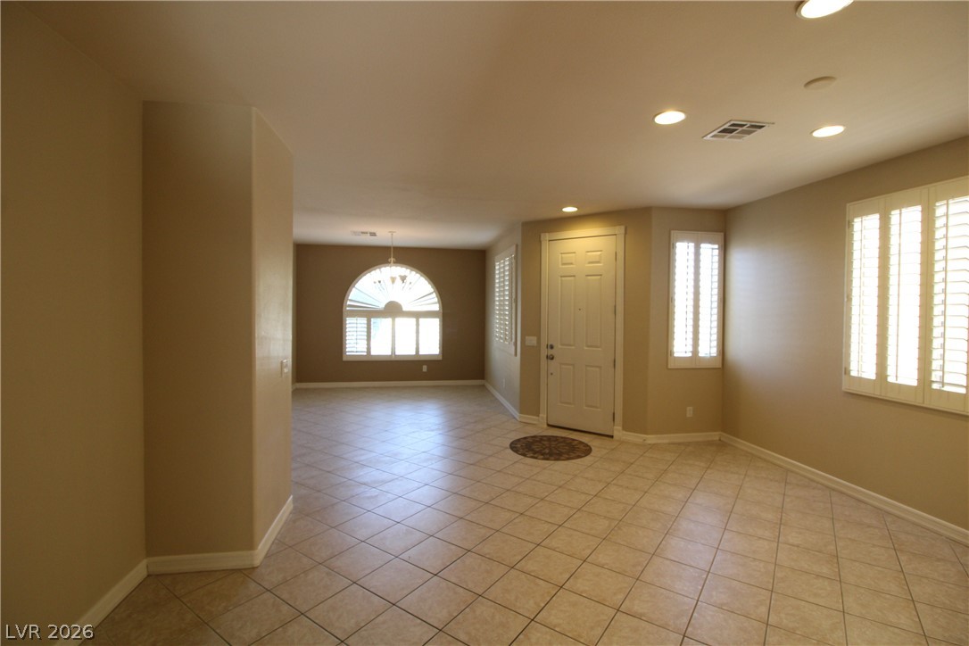 754 Rise Canyon Drive Henderson, NV 89052 - Photo 17 of 34 A graceful entry with tile flooring and abundant natural light from multiple windows.