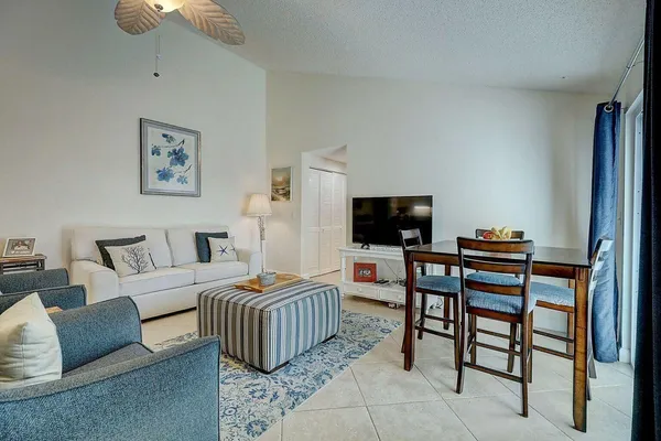 a bedroom with furniture and a flat screen tv
