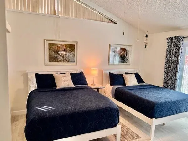 a bedroom with a large bed and a couch