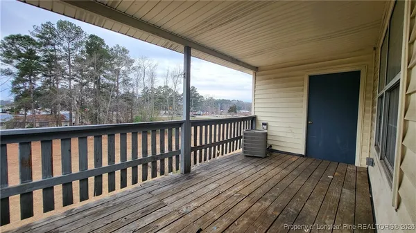 a view of balcony with wooden floor