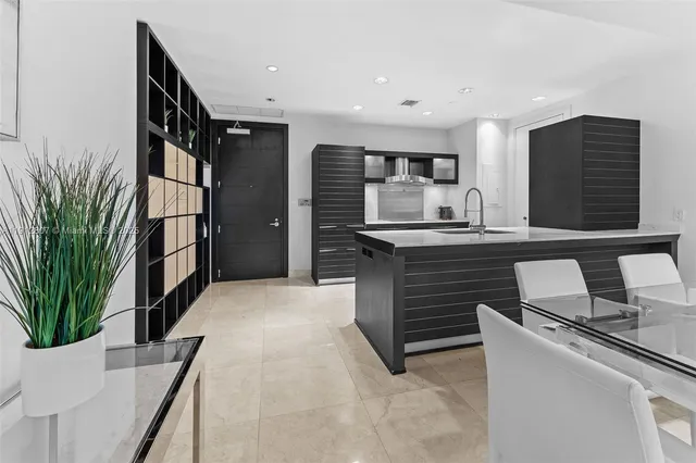 a kitchen with a table and chairs in it