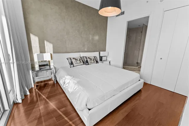 a bathroom with a shower toilet and sink