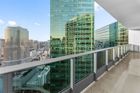 a view of a city skyline from a balcony