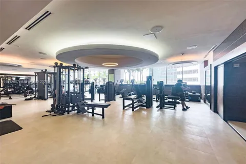 a view of a swimming pool with outdoor seating