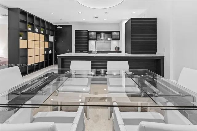 a view of kitchen with granite countertop lots of counter top space