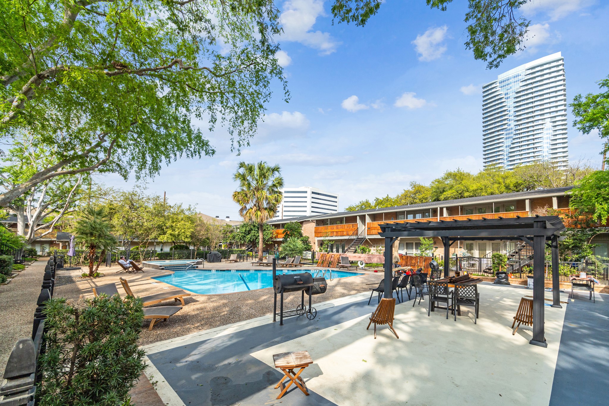 an outdoor space with lots of furniture and garden