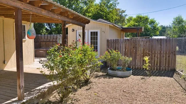 a kitchen with stainless steel appliances granite countertop a refrigerator a stove and a wooden floors