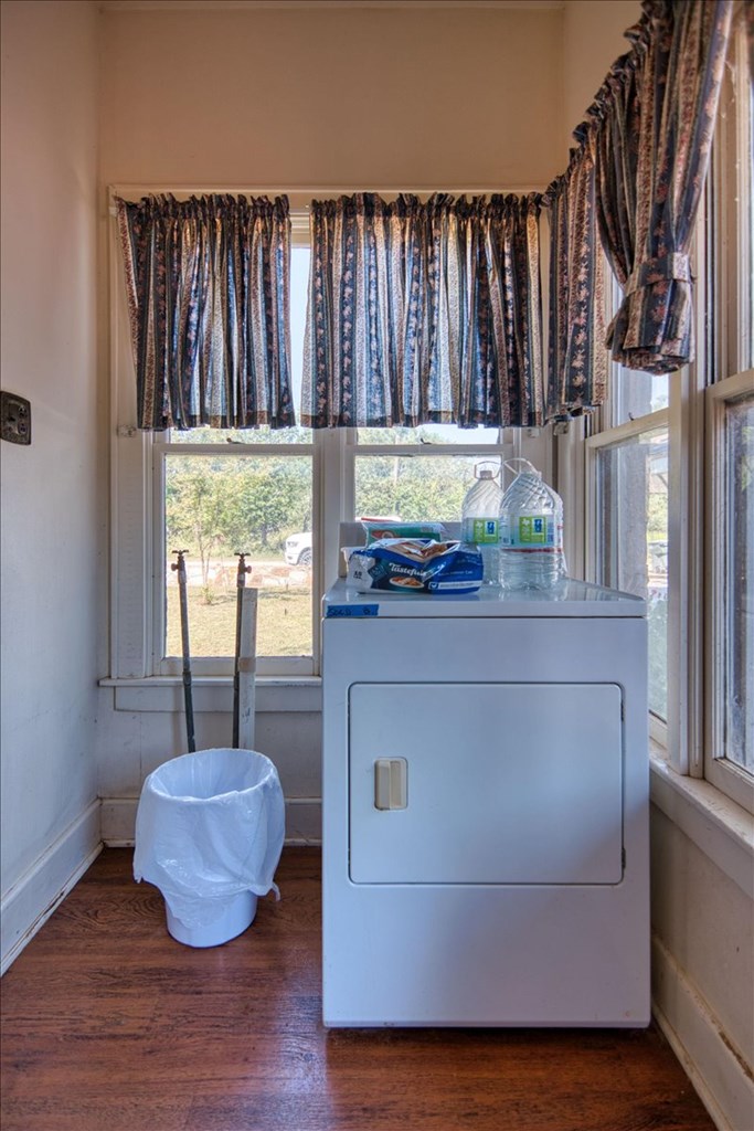 310 Canal Street Menard, TX 76859 - Photo 36 of 66 a kitchen with a window and wooden floor