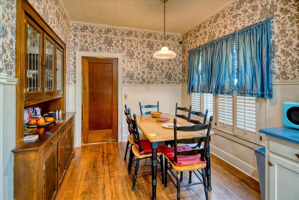 310 Canal Street Menard, TX 76859 - Photo 38 of 66 a dining room with furniture and wooden floor
