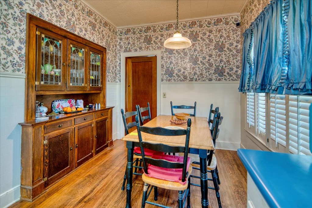 310 Canal Street Menard, TX 76859 - Photo 39 of 66 a kitchen with stainless steel appliances granite countertop a stove a kitchen island a blue cabinets and chairs
