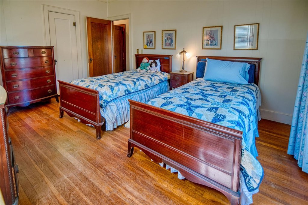 310 Canal Street Menard, TX 76859 - Photo 44 of 66 a bedroom with two beds and painting on the wall