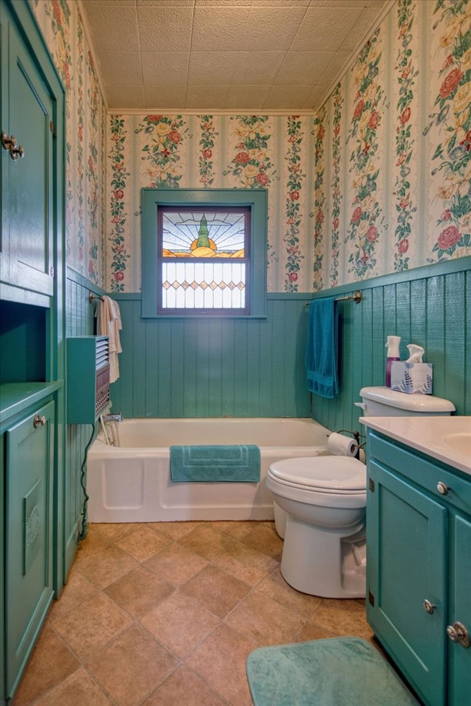 310 Canal Street Menard, TX 76859 - Photo 45 of 66 a bathroom with a toilet sink and mirror