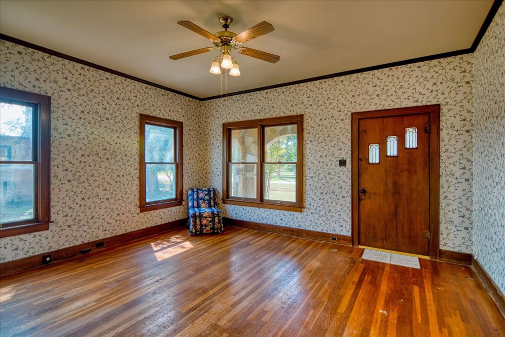 310 Canal Street Menard, TX 76859 - Photo 46 of 66 a view of an empty room with wooden floor and a window