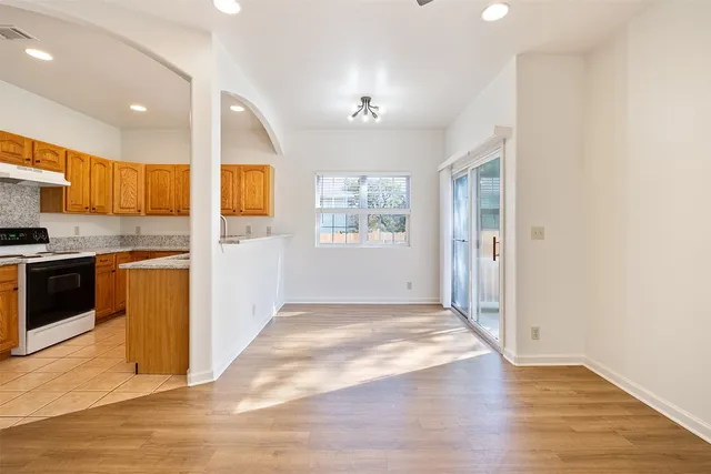 a view of a kitchen with a sink and a window
