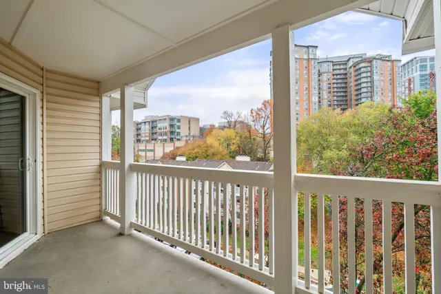 a car parked in front of a white building