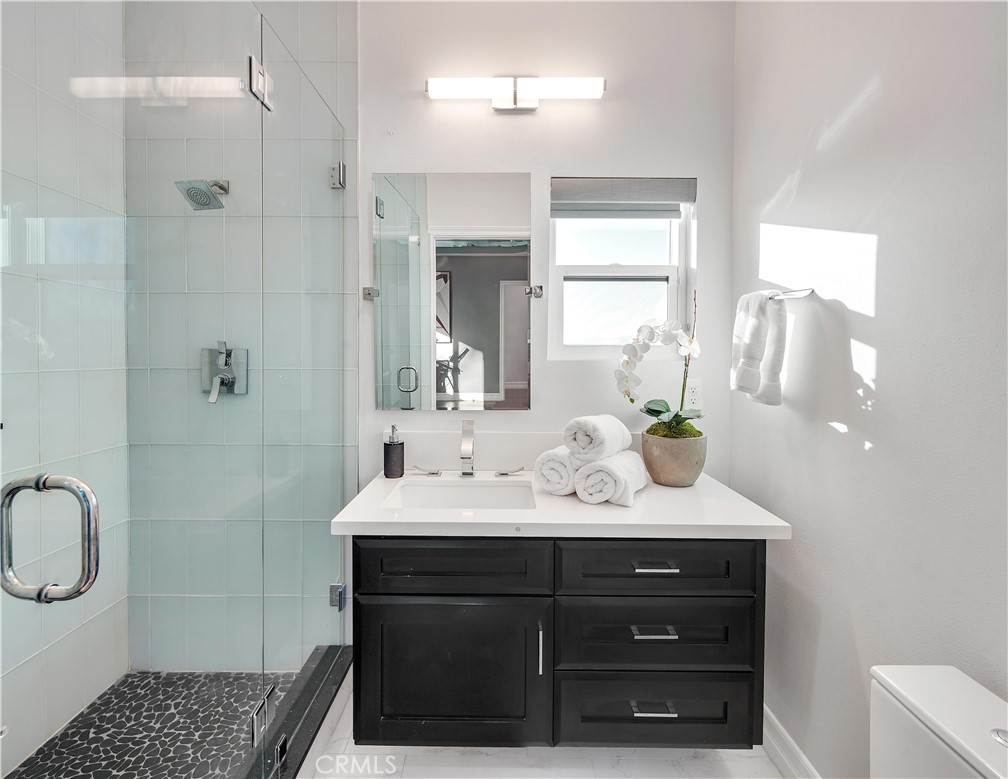 1693 Marion Road Redlands, CA 92374 - Photo 27 of 49 a bathroom with a sink a toilet and shower