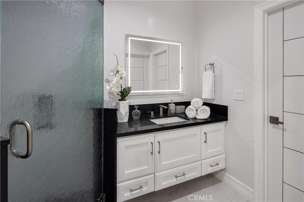 1693 Marion Road Redlands, CA 92374 - Photo 30 of 49 a bathroom with a sink and a mirror