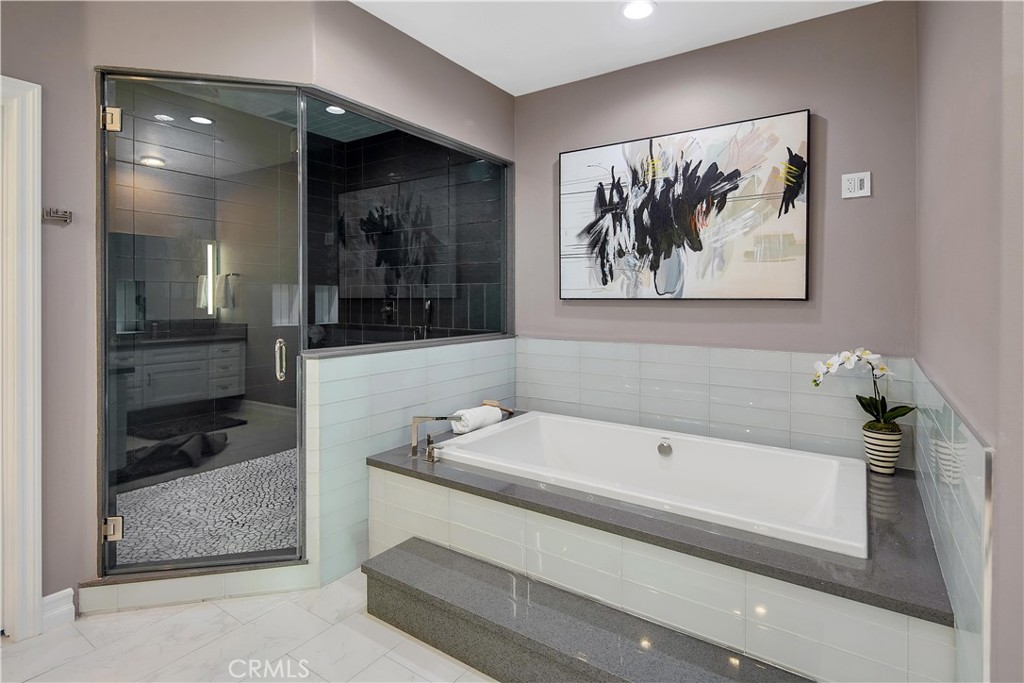 1693 Marion Road Redlands, CA 92374 - Photo 35 of 49 a bathroom with a bathtub and a double vanity sink