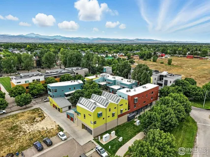 an aerial view of a house with yard swimming pool and outdoor seating