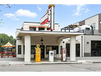 a view of a building with traffic signal lights