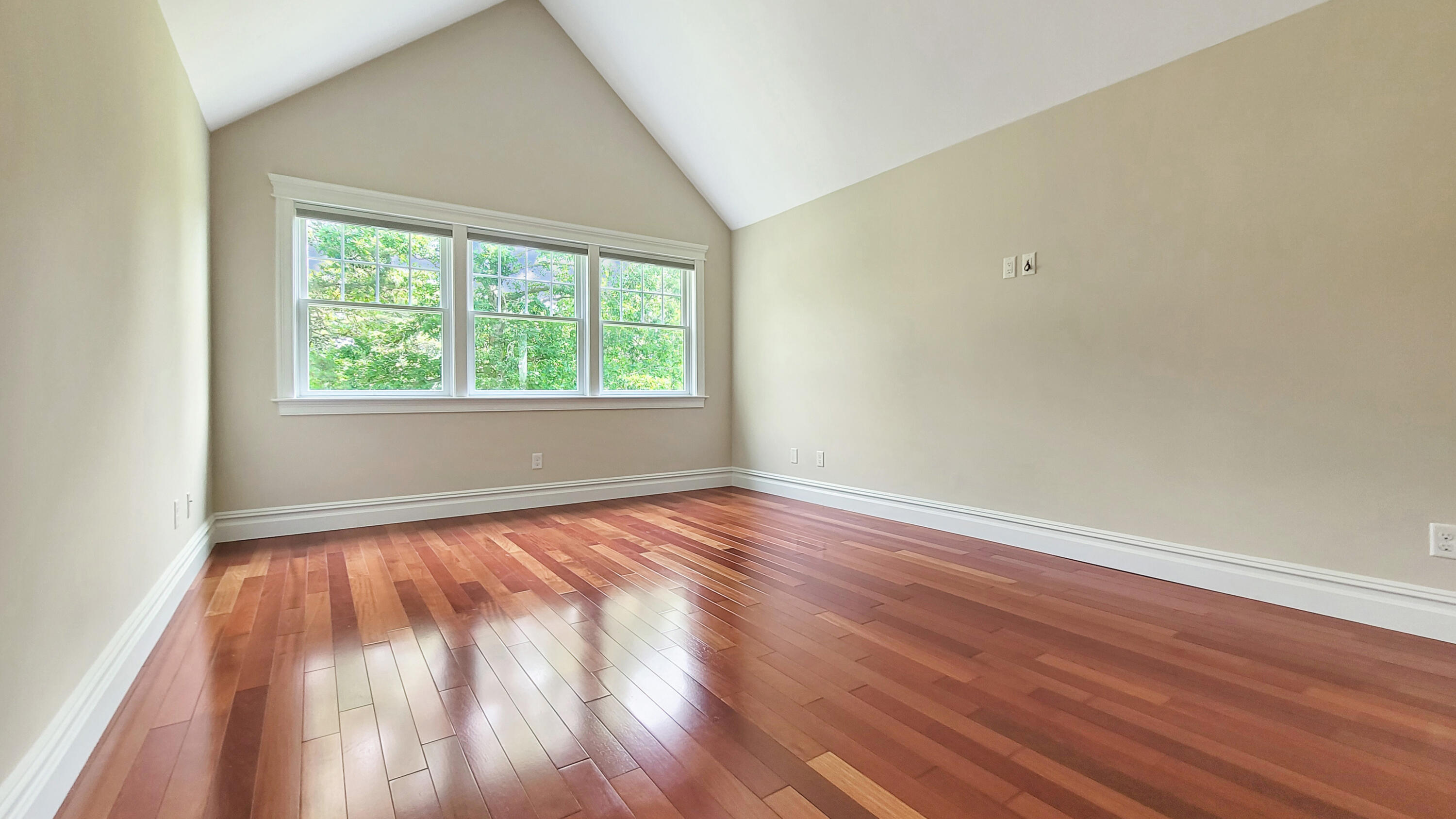 4 Quinns Way Mashpee, MA 02649 - Photo 16 of 28 an empty room with wooden floor and windows