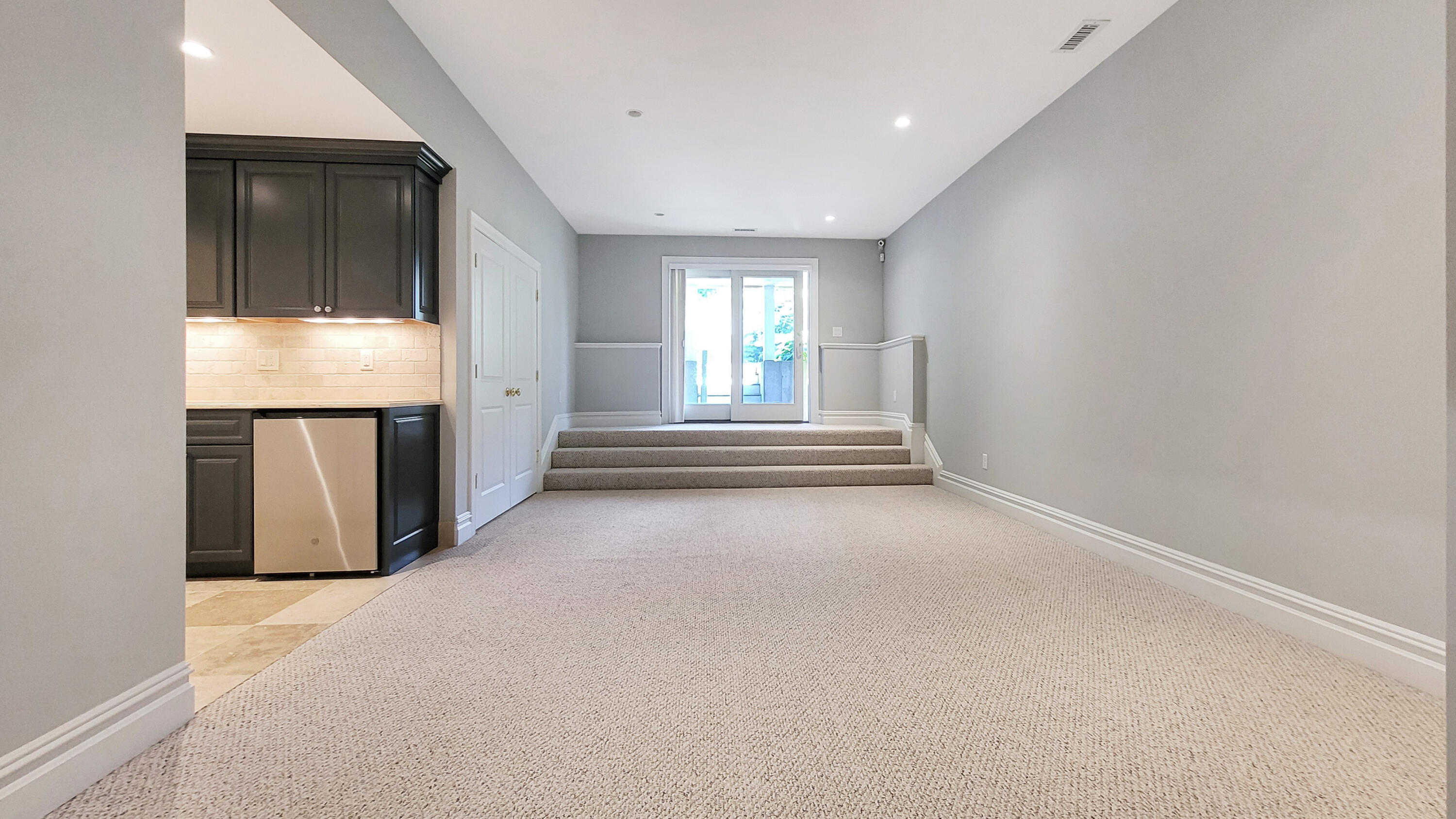 4 Quinns Way Mashpee, MA 02649 - Photo 20 of 28 an empty room with wooden floor and windows