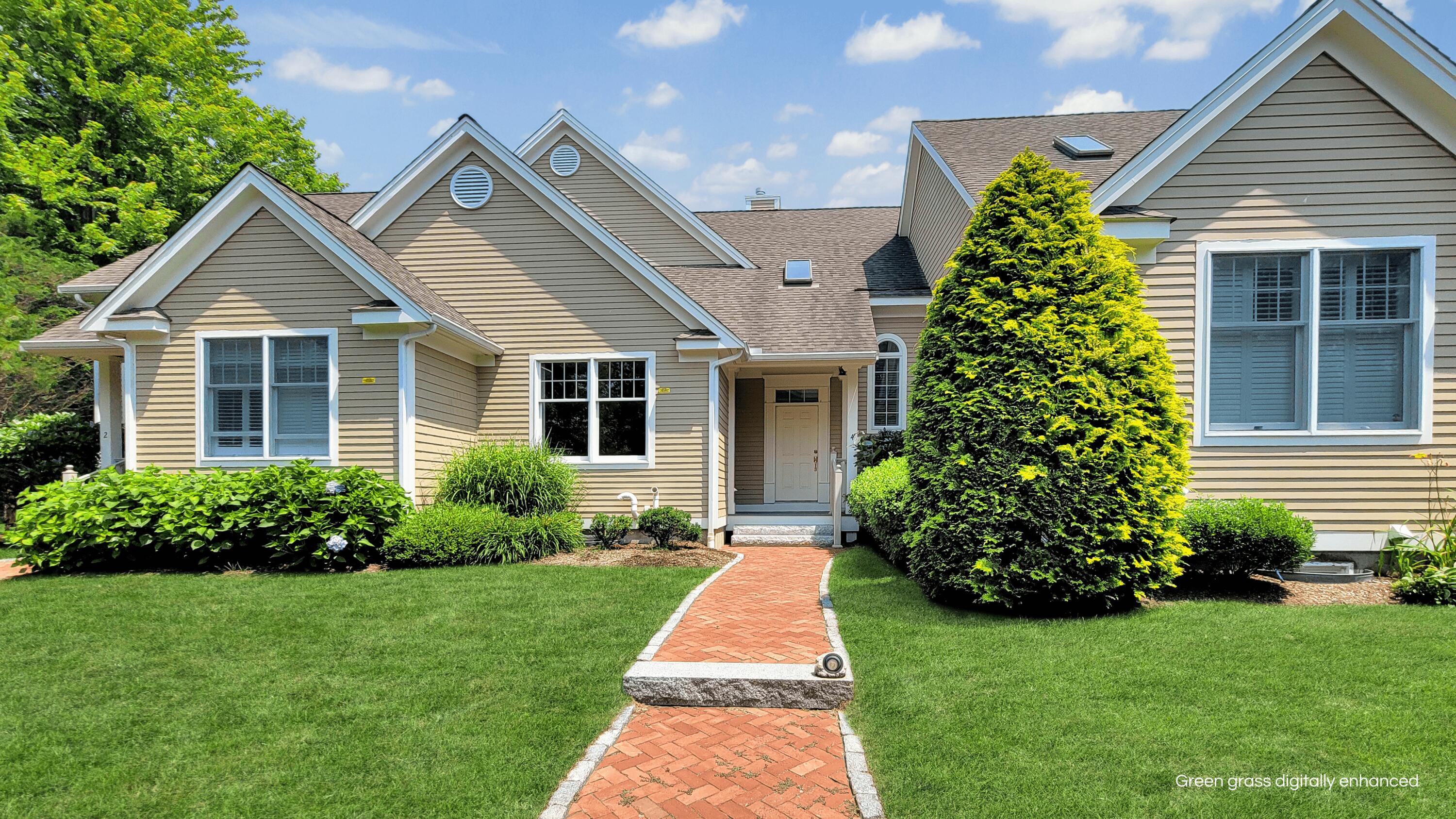 4 Quinns Way Mashpee, MA 02649 - Photo 2 of 28 a front view of a house with a yard and potted plants