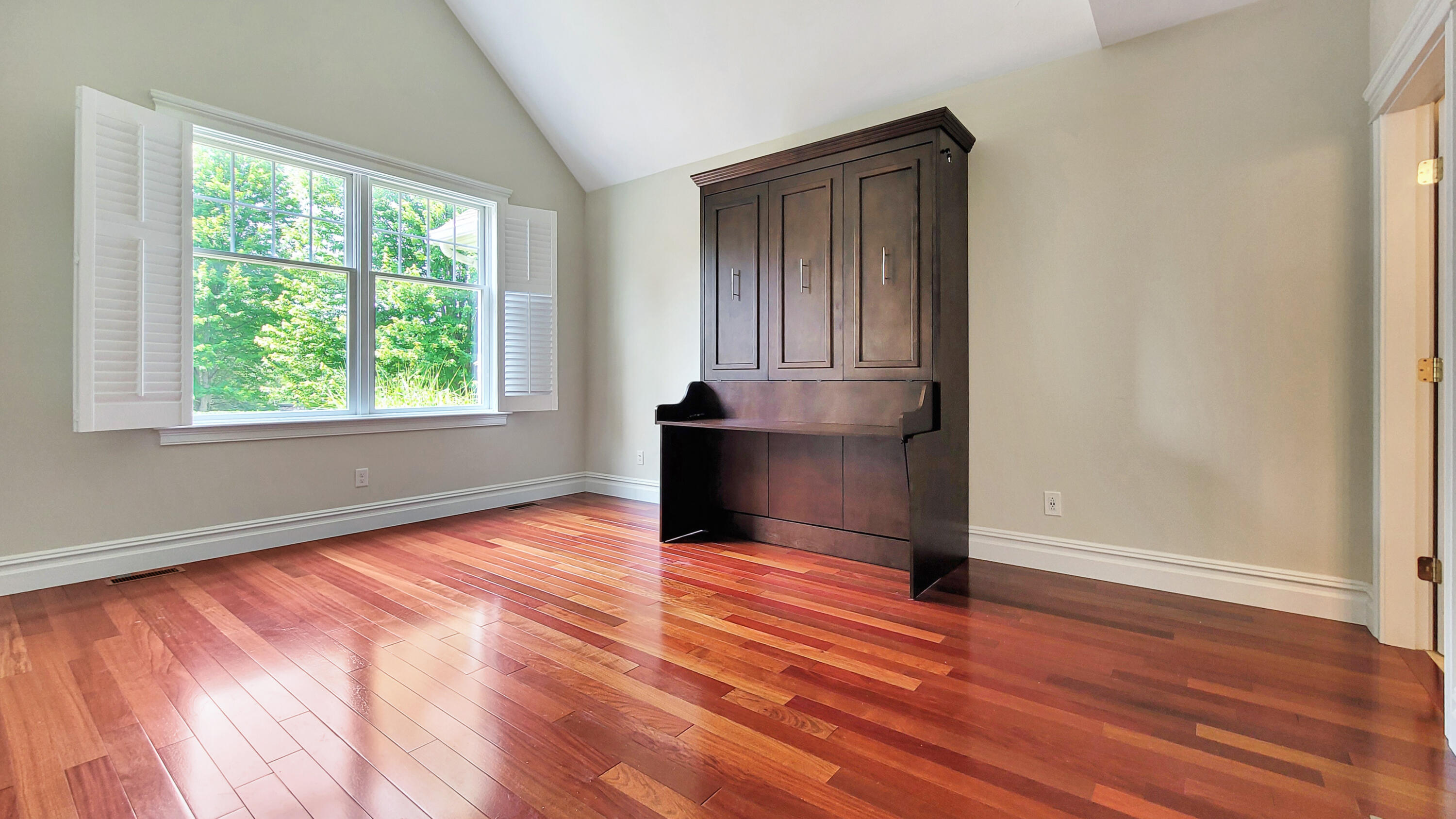 4 Quinns Way Mashpee, MA 02649 - Photo 5 of 28 an empty room with wooden floor and windows