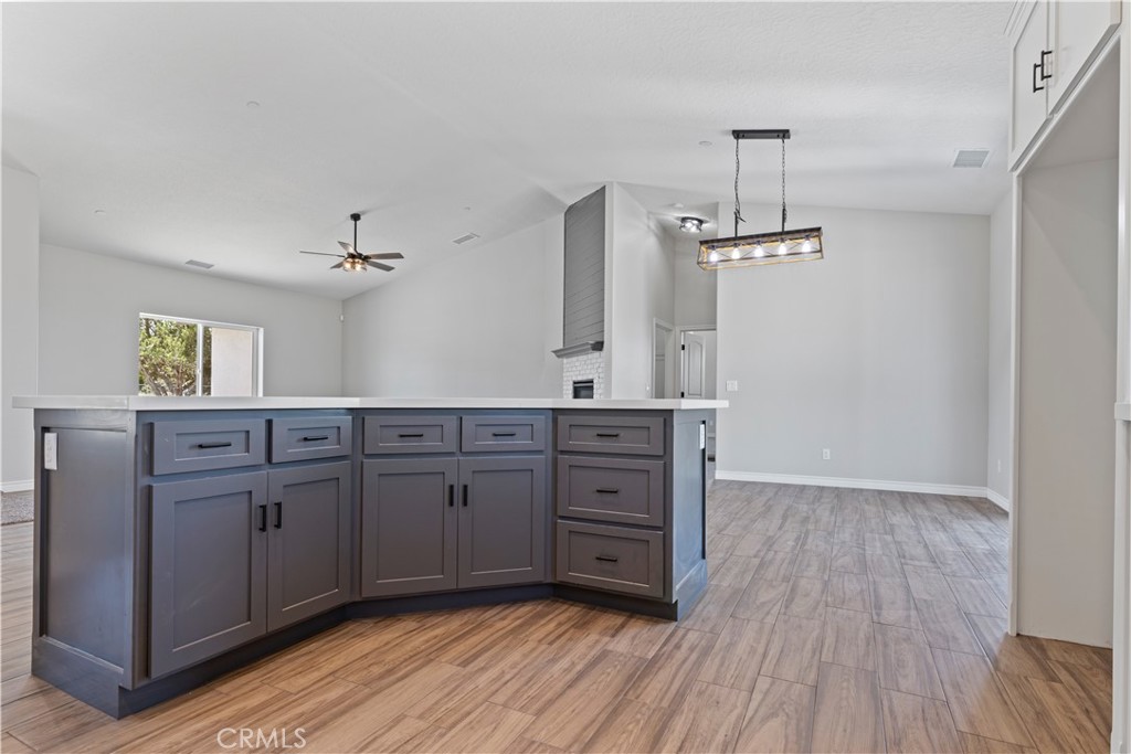 14586 Ash Hesperia, CA 92345 - Photo 12 of 30 a room with lots of wooden floors and wooden cabinets