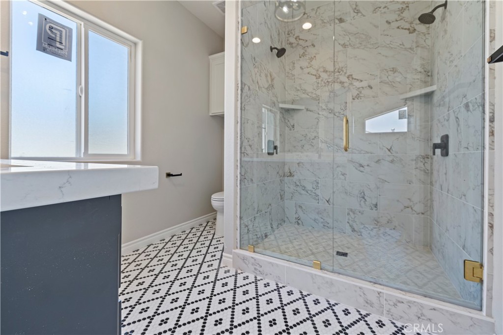 14586 Ash Hesperia, CA 92345 - Photo 26 of 30 a bathroom with a shower