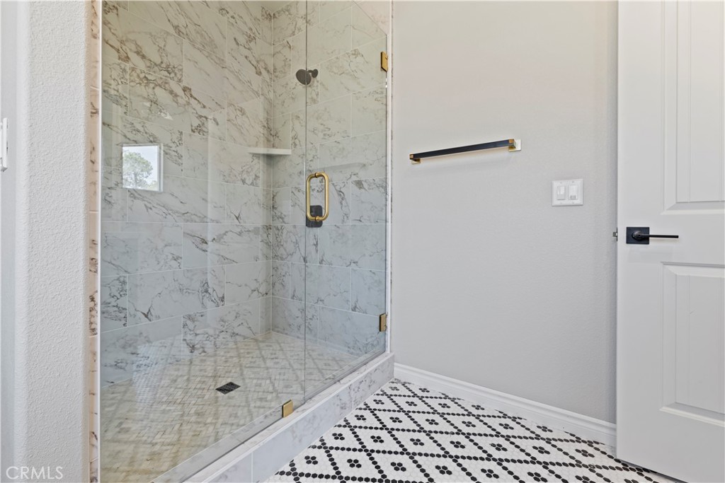 14586 Ash Hesperia, CA 92345 - Photo 27 of 30 a bathroom with a shower