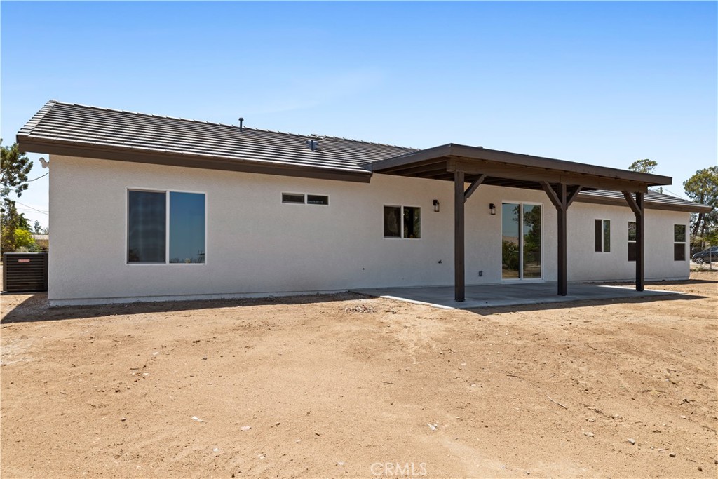 14586 Ash Hesperia, CA 92345 - Photo 29 of 30 a front view of a house with a yard