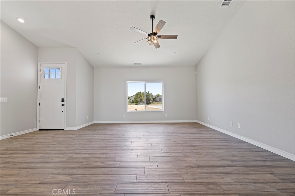 14586 Ash Hesperia, CA 92345 - Photo 4 of 30 wooden floor in an empty room with a window