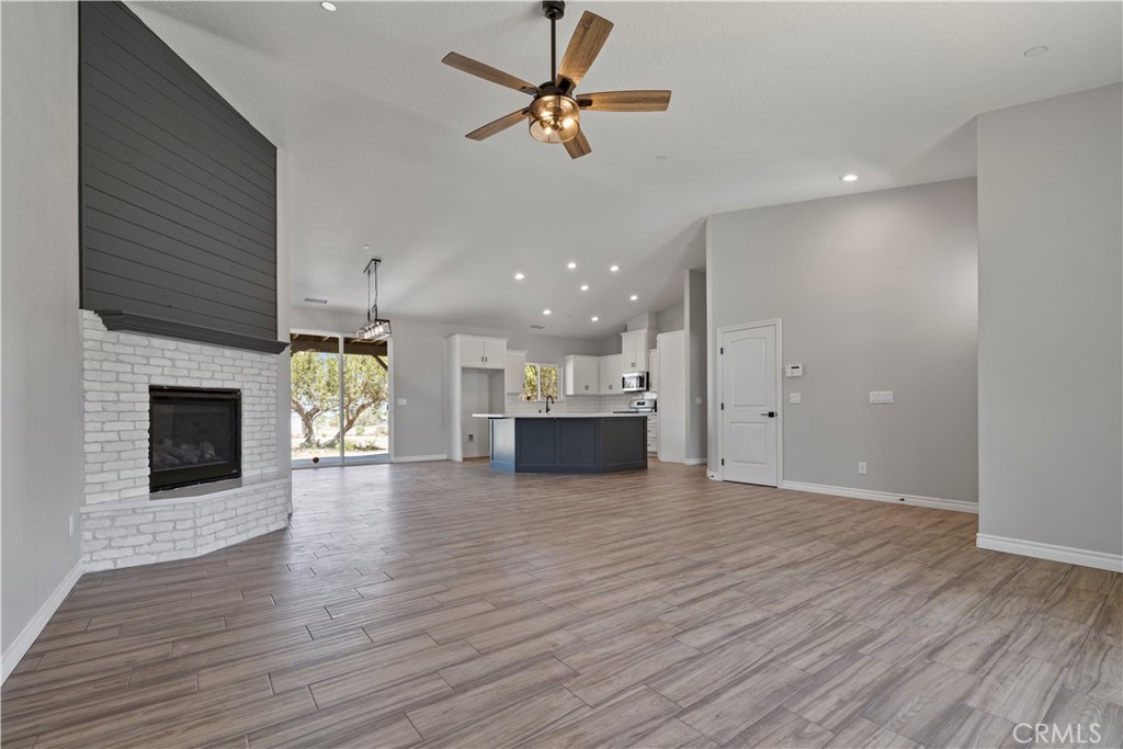 14586 Ash Hesperia, CA 92345 - Photo 6 of 30 a view of a kitchen with a sink and a fireplace