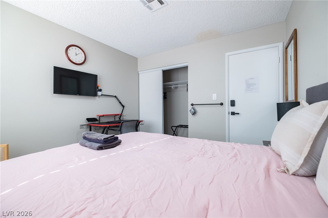 6356 West Viking Road Las Vegas, NV 89103 - Photo 39 of 51 Plentiful natural light fills this comfortable bedroom featuring a practical closet.