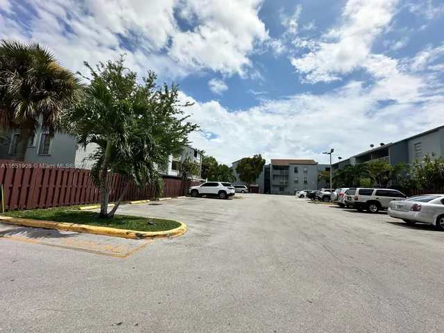 a view of street with parked cars