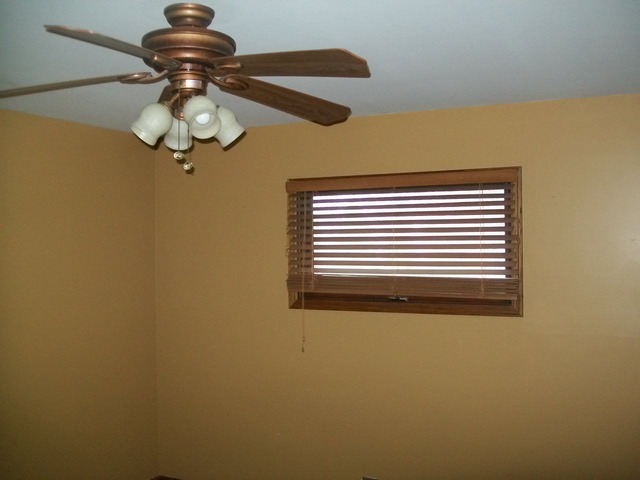 26155 West Lotus Road Antioch, IL 60002 - Photo 12 of 14 a view of a chandelier fan and wooden floor