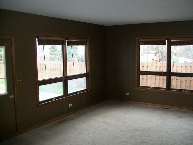 26155 West Lotus Road Antioch, IL 60002 - Photo 7 of 14 a view of an empty room with a window